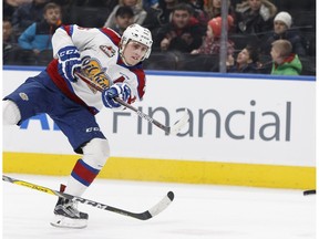 Edmonton's Davis Koch (16) fires a slapshot as Kootenay's Kurtis Rutledge reaches in during a WHL game between the Edmonton Oil Kings and the Kootenay Ice at Rogers Place in Edmonton on Wednesday, March 1, 2017.