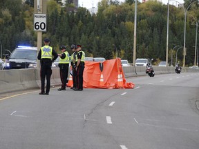 Police investigate a fatal collision in the northbound lane of Groat Road Bridge in Edmonton, Alta., on Sunday, Sept. 24, 2017.