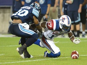 Montreal Alouettes' Brandon Stewart, right, recovers a dropped punt reception by Toronto Argonauts' Martese Jackson during second half CFL action at BMO Field in Toronto Saturday, September 23, 2017, in Toronto. The turnover would lead to a Montreal touchdown several plays later.