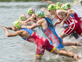 The swim start of the Elite Men race in Hawrelak Park in the ITU Triathlon on July 29, 2017.