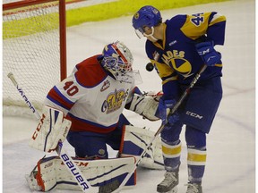 Edmonton Oil Kings goalie Travis Child (left) makes a save on Saskatoon Blades Chase Wouters (right) during pre-season WHL hockey action in Edmonton on Saturday September 16, 2017. The Oil Kings open the regular season at the Red Deer Rebels on Saturday.