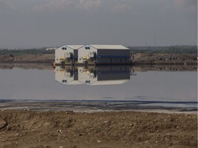 A pump house and barge in a Suncor tailings pond at the oilsands near Fort McMurray.