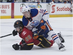 Edmonton Oilers Kailer Yamamoto tries to get past Calgary Flames Adam Ollas Mattsson while chasing a loose puck during the NHL Young Stars Classic hockey action at the South Okanagan Events Centre in Penticton, BC, September, 8, 2017.