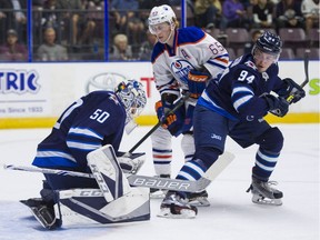 Winnipeg Jets goalie Jamie Phillips (left) makes a glove save while Edmonton Oilers Chad Butcher (middle) and Jets Michael Webster battle for position during NHL preseason hockey action at the Young Stars Classic held at the South Okanagan Events Centre in Penticton, BC, September 9, 2017. (Richard Lam/PNG) (For ) 00050535A
RICHARD LAM Ted Rhodes, PNG