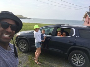 The Lipscombe family on a trip to St. John's, N.L., with six-foot-three driver Jesse, left, mom Julia holding Indiana while Tripp and Chile sit in the Acadia SUV.