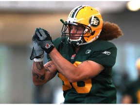 Aaron Grymes goes through drills during Edmonton Eskimos' training camp at Commonwealth Fieldhouse Edmonton, Alta., on Monday, June 9, 2014.