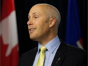 Alberta Party Leader Greg Clark speaks to the media after the Alberta government announced that the province's minimum wage will increase from $10.20 to $11.20 as of Oct. 1., during a press conference at the Alberta Legislature in Edmonton Alta. on Monday June 29, 2015. File photo.