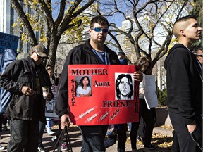 The Alook family attended the Stolen Sisters Awareness Movement march in 2015 in Edmonton. Here, a family member carries a poster of Elaine Alook, who was last seen in 2004.