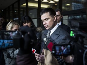 Defence lawyer Dino Bottos reacts after the sentencing of Richard Suter at the Alberta Law Courts in 2015.