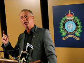 Former Edmonton Police Association president Tony Simioni talks to the media on Friday, Dec. 12, 2014, in Edmonton. The association will have a new president in December after an election. Simioni said the difference between being a police officer and running a police association "is like trying to watch a police show on television and then going and being a police officer. It's ridiculously different."