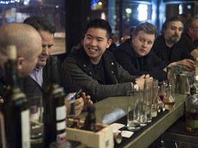 Restaurateur Kevin Cam, centre, is opening two new cocktail spots in downtown Edmonton.