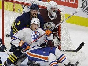 Edmonton Oilers rookie Davis Koch is checked by MacEwan-NAIT All-Stars Taylor Bilyk (#3) in front of All-Stars goalie Marc-Olivier Daigle during first period game action at the 2017 Rookie Game held at Rogers Place in Edmonton on Wednesday September 13, 2017.