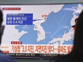 People watch a TV news program reporting North Korea's earthquake, at Seoul Railway Station in Seoul, South Korea, Saturday, Sept. 23, 2017. South Korea's weather agency said an earthquake was detected in North Korea on Saturday around where the country recently conducted a nuclear test, but it assessed the quake as natural. The signs read " The weather agency said a magnitude 3.0 earthquake was detected in North Korea." (AP Photo/Ahn Young-joon)