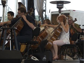 Members of the Edmonton Symphony Orchestra take part in the dress rehearsal of the Symphony Under the Sky at Hawrelak Park on Thursday Aug. 31, 2017, in Edmonton.