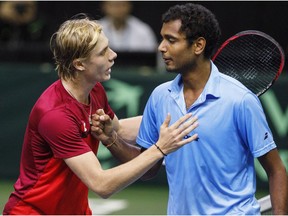 Canada's Denis Shapovalov, left, and India's Ramkumar Ramanathan congratulate each other after Davis Cup singles tennis in Edmonton, Alta., on Sunday September 17, 2017.