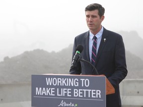 Mayor Don Iveson speaks to media at a funding announcement for the southeast Valley Line LRT in a construction area near 75 Street and Whitemud Drive in Edmonton, Alta., on Friday, Sept. 15, 2017.