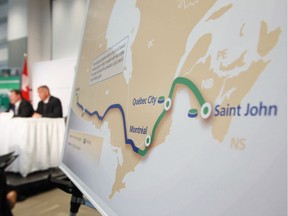 TransCanada president and Chief Executive Officer Russ Girling, right, and Trans Canada's President of Energy and Oil Pipelines  Alex Pourbaix speak at their company's announcement of an Energy East Pipeline project on Aug. 1, 2013. File photo.