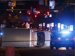 An overturned U-Haul truck is seen on 100 Avenue near 106 Street after Edmonton Police Service officers arrested a man following the attack on a police officer outside of an Edmonton Eskimos game at 92 Street and 107A Avenue in Edmonton, Alberta on Sunday, October 1, 2017.