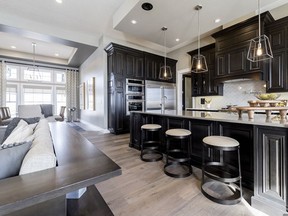 The Club & Residences of River's Gate, a gated community in Sturgeon County, has recently opened a showhome by Alquinn Homes that features a modern classic style with dark wood cabinetry.