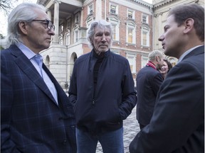 Musician Roger Waters (centre) stands with Canadian Indigenous Leader Phil Fontaine (left) and Paul Paz y Mino, Associate Director of Amazon Watch, on the steps of an Ontario Court House  in Toronto on Tuesday Oct. 10, 2017.