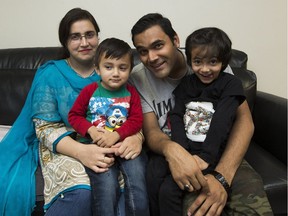 New immigrants Ghazanfar Siraj, his wife Adeela Javed, and their kids, Muhammed, 2, and Meesha, 5, on Wednesday, Oct. 25, 2017.