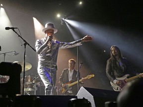 Gord Downie (middle) and The Tragically Hip perform in concert at Rexall Place in Edmonton on Thursday July 28, 2016.