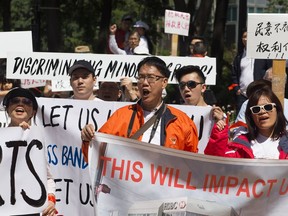 Community members from the Boyle, McCauley and Central McDougall neighbourhoods protest the concentration of supervised injection sites, at the Alberta Legislature in Edmonton Sat. June 17, 2017. File photo.