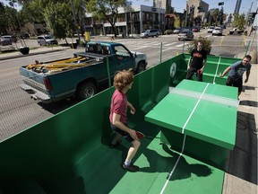 (left to right) Trevor Dunn, Alex Garneau, and Shawn Skinner play table tennis in a pop-up park along Jasper Avenue near 112 Street, in Edmonton Tuesday Aug. 8, 2017. The park is part of the Experience Jasper Avenue Design Demo, which includes pop-up parks, murals, trees and landscaping, along Jasper Avenue between 109 Street and 115 Street.