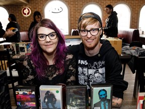 Laura Seymour, left, and Jon Moretta travelled from Calgary to set up a table at the VHS and Pop Culture Oddities Fair at the Brick and Whiskey in Edmonton on Saturday, Oct. 7, 2017.