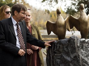 Lyle and Marie McCann's son Bret McCann, looks at the newly unveiled sculpture that celebrates the lives of his parents in St. Albert on Sunday, Oct. 15, 2017.