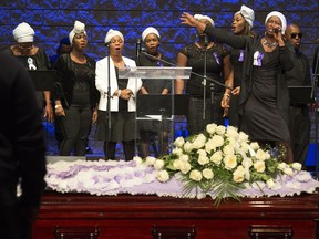 Singers perform during a funeral service for Glorious Decontee David at North Pointe Community Church, in Edmonton Saturday Oct. 21, 2017. David was one of three women killed in a crash involving a stolen truck near Lloydminster Sept. 22, 2017.