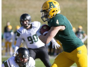 University of Alberta Golden Bears' Ed Ilnicki (4) carries the ball against the University of Saskatchewan Huskies  at Foote Field, in Edmonton Saturday Oct. 21, 2017. Ilnicki ran for 278 yards on 29 carries with three touchdowns in his final home game with the Golden Bears in a 49-23 victory.