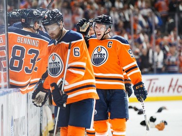 Edmonton Oilers star Connor McDavid, right, celebrates his hat-trick goal against the Calgary Flames on Oct. 4, 2017, at Edmonton's Rogers Place.