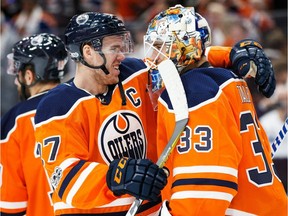 Connor McDavid, who had a hat trick, celebrates with goaltender Cam Talbot, who posted a shutout, after the Edmonton Oilers beat the Calgary Flames on Oct. 4, 2017, at Rogers Place.