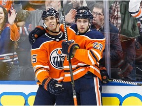 Darnell Nurse #25 and Leon Draisaitl #29 of the Edmonton Oilers celebrate Draisaitl's goal against the Winnipeg Jets at Rogers Place on October 9, 2017 in Edmonton, Canada.