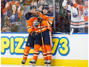 Darnell Nurse #25 and Leon Draisaitl #29 of the Edmonton Oilers celebrate Draisaitl's goal against the Winnipeg Jets at Rogers Place on October 9, 2017 in Edmonton, Canada.