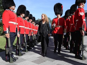 Newly sworn in Gov. Gen. Julie Payette inspects the honour guard at Rideau hall in Ottawa, Ontario, on Monday, Oct. 2, 2017.