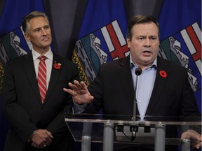 United Conservative Party Leader Jason Kenney speaks to reporters the day after being elected the first official leader of the new party as MLA Dave Rodney looks on in Calgary, Alta., on Sunday, Oct. 29, 2017.