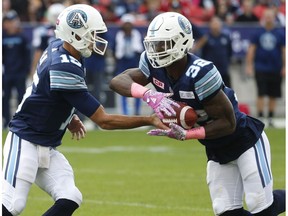 Toronto Argonauts Ricky Ray QB (15) hands off to  James Wilder Jr. RB (32)during the first half at BMO Field in Toronto, Ont. on Saturday October 7, 2017. Ja