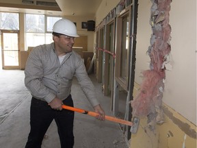 Bissell Centre CEO Gary takes a sledgehammer to a wall as Bissell Centre renovations to its downtown facility are underway with a grand re-opening scheduled for February 2018. Taken  on Wednesday, Oct. 18, 2017, in Edmonton.