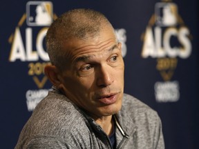 New York Yankees manager Joe Girardi raeacts as he answers reporters' questions during a press conference Sunday, Oct. 15, 2017. The Yankees face the Houston Astros in Game 3 of the ALCS Monday night in New York.