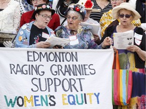 The Edmonton Raging Grannies sang as women from all walks of life posed for a photo on the steps of the Alberta Legislature in Edmonton, Alta., on Tuesday April 19, 2016 to mark the centennial of equal voting.