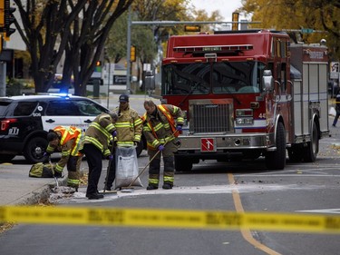 Crews clean up the scene where a cube van ran into pedestrians and later flipped over while being pursued by police, in Edmonton Alta, on Sunday October 1, 2017. THE CANADIAN PRESS/Jason Franson ORG XMIT: EDM101
JASON FRANSON,