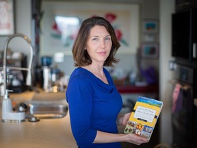 Jennifer Cockrall-King with her new book Food Artisans of the Okanagan in her Edmonton home on March 30, 2016.