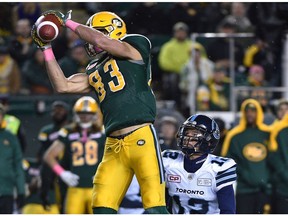 Edmonton Eskimos Brandon Zylstra (83) makes catch on Toronto Argonauts Mitchell White (12) during CFL action at Commonwealth Satdium in Edmonton, October 14, 2017.