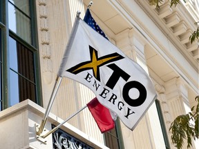 A flag flies otuside the headquarters building of XTO Energy Inc. in Fort Worth, Texas. File photo.