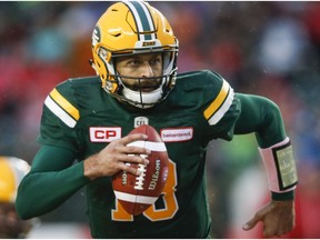 Edmonton Eskimos quarterback Mike Reilly runs with the ball during first half CFL football action against the Toronto Argonauts, in Edmonton, Saturday, Oct. 14, 2017.