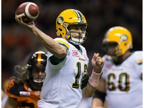Edmonton Eskimos quarterback Mike Reilly passes against the B.C. Lions during the first half of a CFL football game in Vancouver, B.C., on Saturday October 21, 2017.