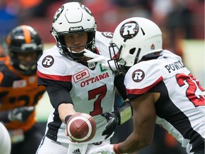 Ottawa Redblacks quarterback Trevor Harris hands off to William Powell during last week's come-from-behind win over B.C. Harris was named one of the CFL's top performers of the week after completing 28 of 38 passes for 389 yards.