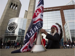 Grand Chief Wilton Littlechild raises the Treaty 6 flag at MacEwan University on its City Centre campus during a ceremony that pays tribute to the Indigenous groups, including the Plains, Woodland Cree, Nakota, Saulteaux, Dene and Métis peoples on Wednesday, Oct. 18, 2017. Edmonton's Indigenous population grew nearly 50 per cent over the last census cycle, data released Wednesday showed.